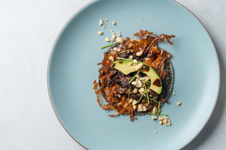 a blue tortilla taco on a plate