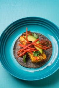a blue tortilla taco on a plate