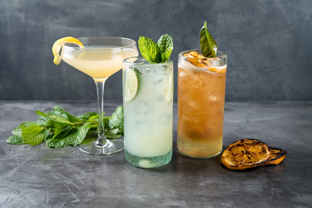 a glass of wine sitting on top of a table