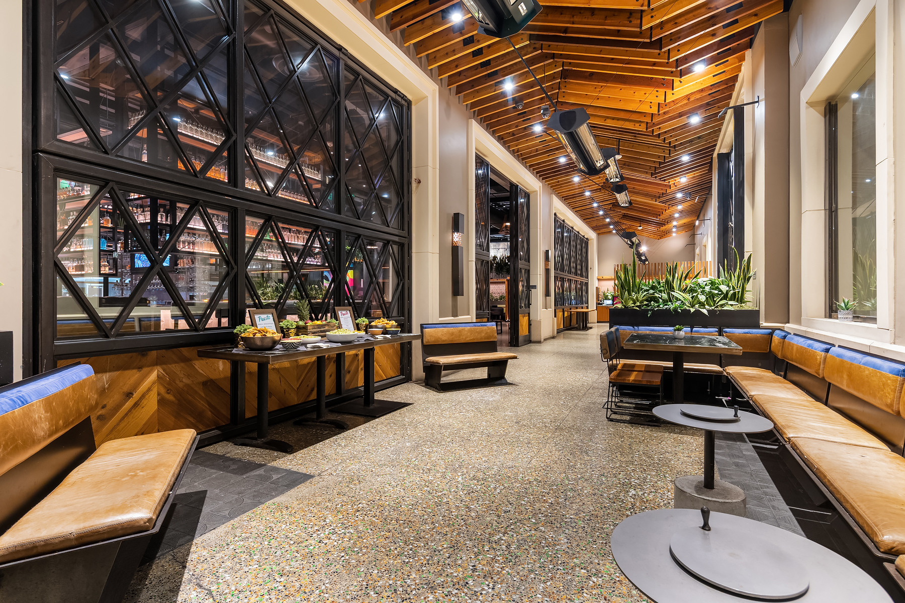 a room filled with furniture next to a building