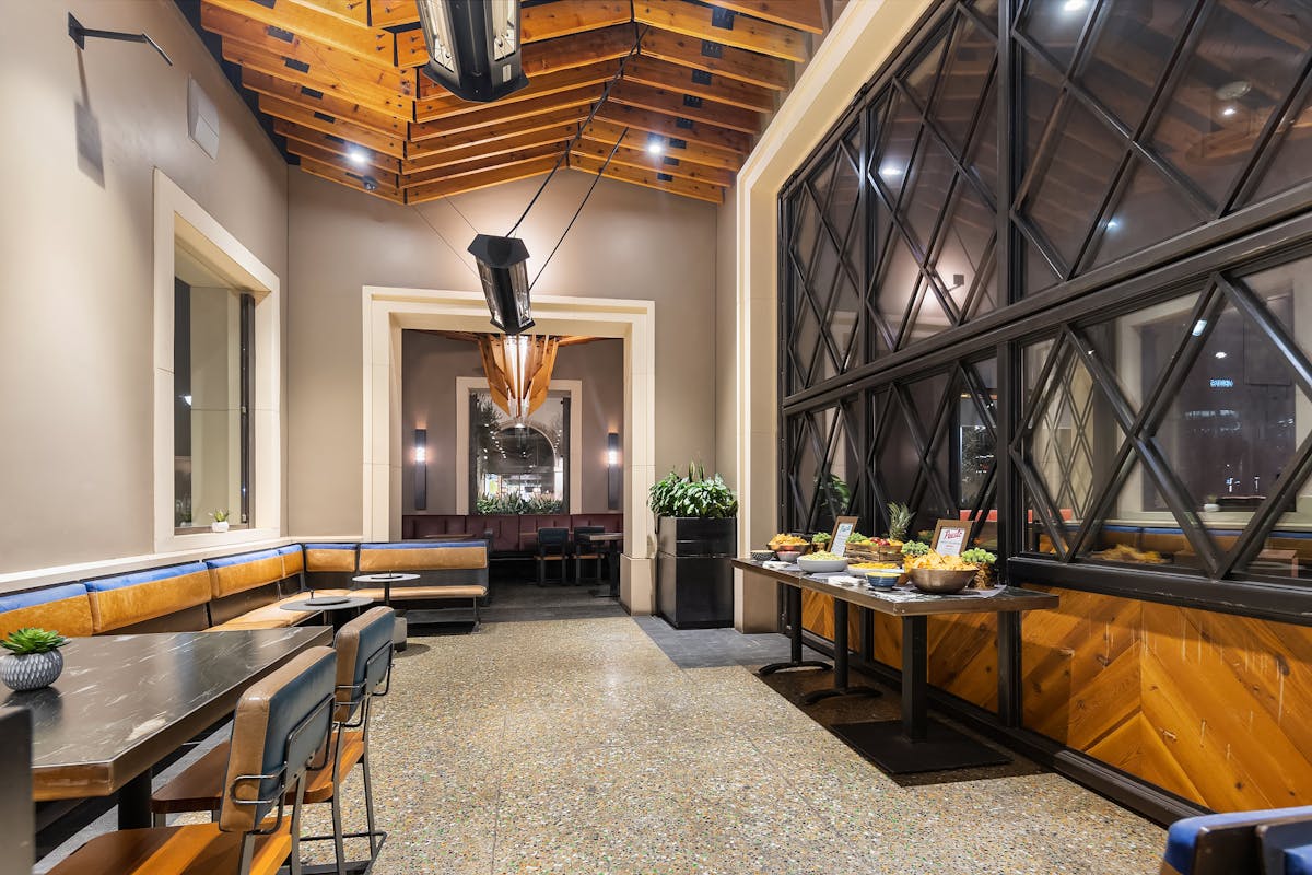 a room filled with furniture and a large window