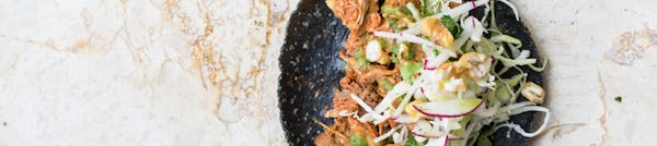 a blue tortilla taco on a table