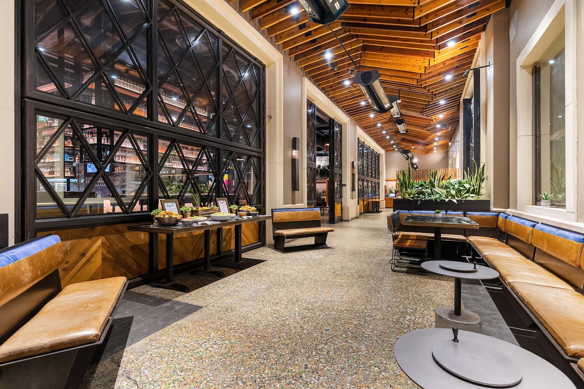 a room filled with furniture next to a building