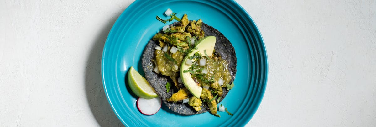 a blue tortilla taco on a plate