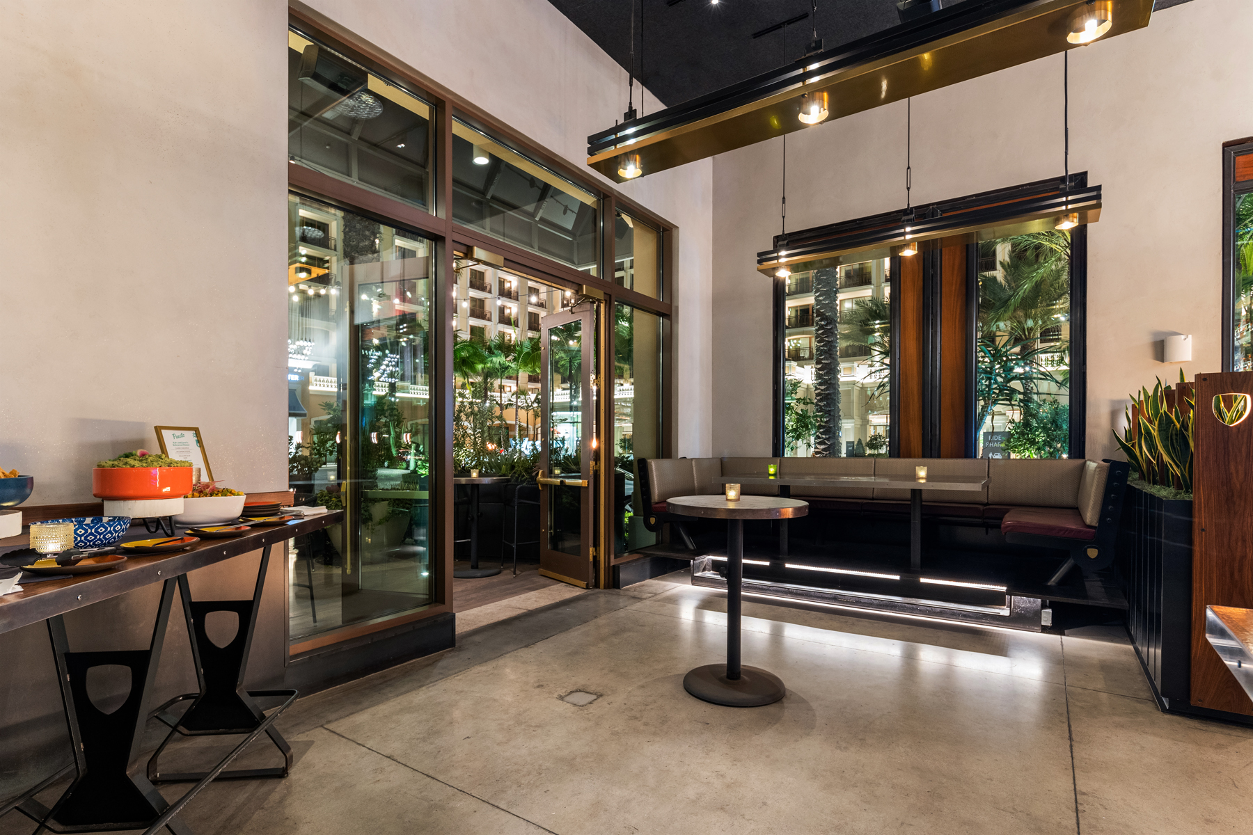 a living room filled with furniture and a large window