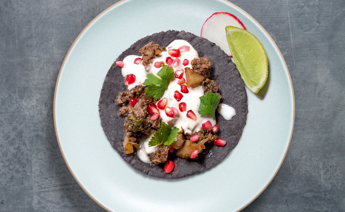 a blue tortilla taco on a plate