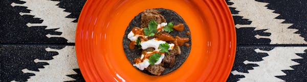 a blue tortilla taco on a plate