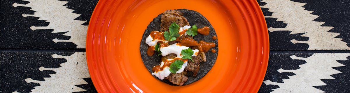 a blue tortilla taco on a plate