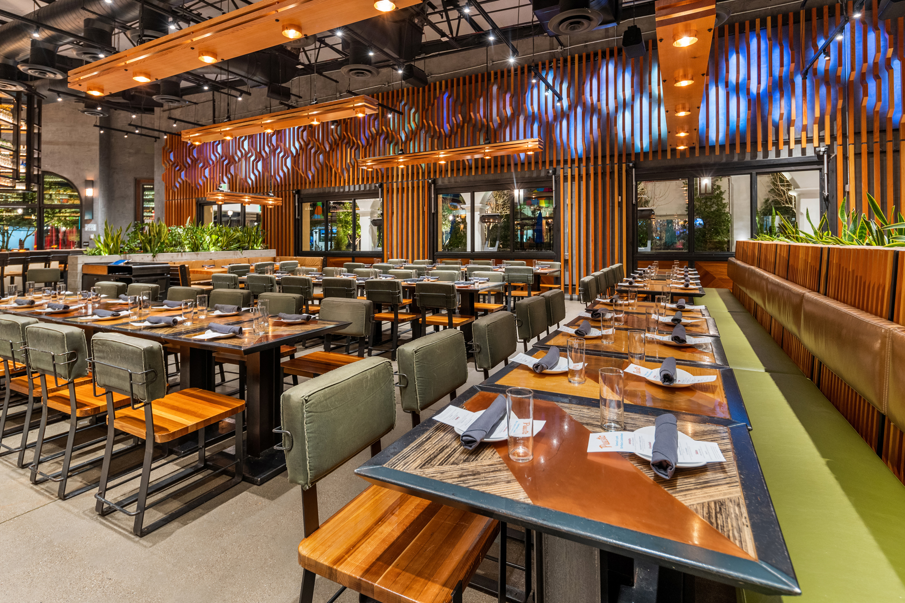 a group of people sitting at a table in front of a store