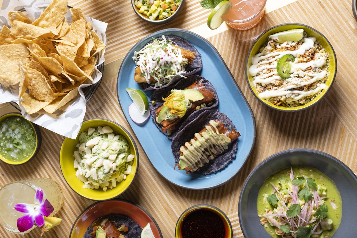 a bunch of food sitting on top of a wooden table