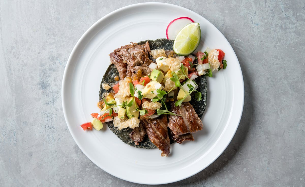 a blue tortilla taco on a plate
