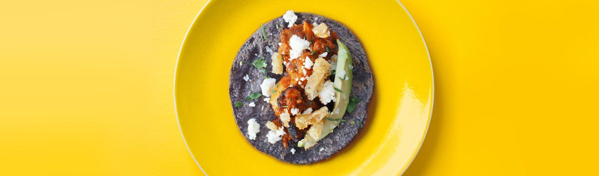 a blue tortilla taco on a plate