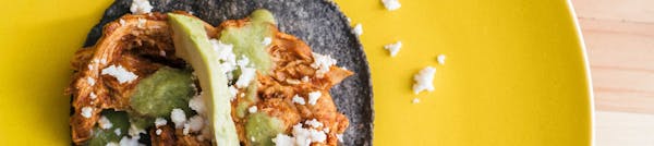 a blue tortilla taco on a plate