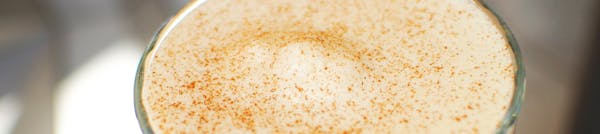 a close up of a coffee foam