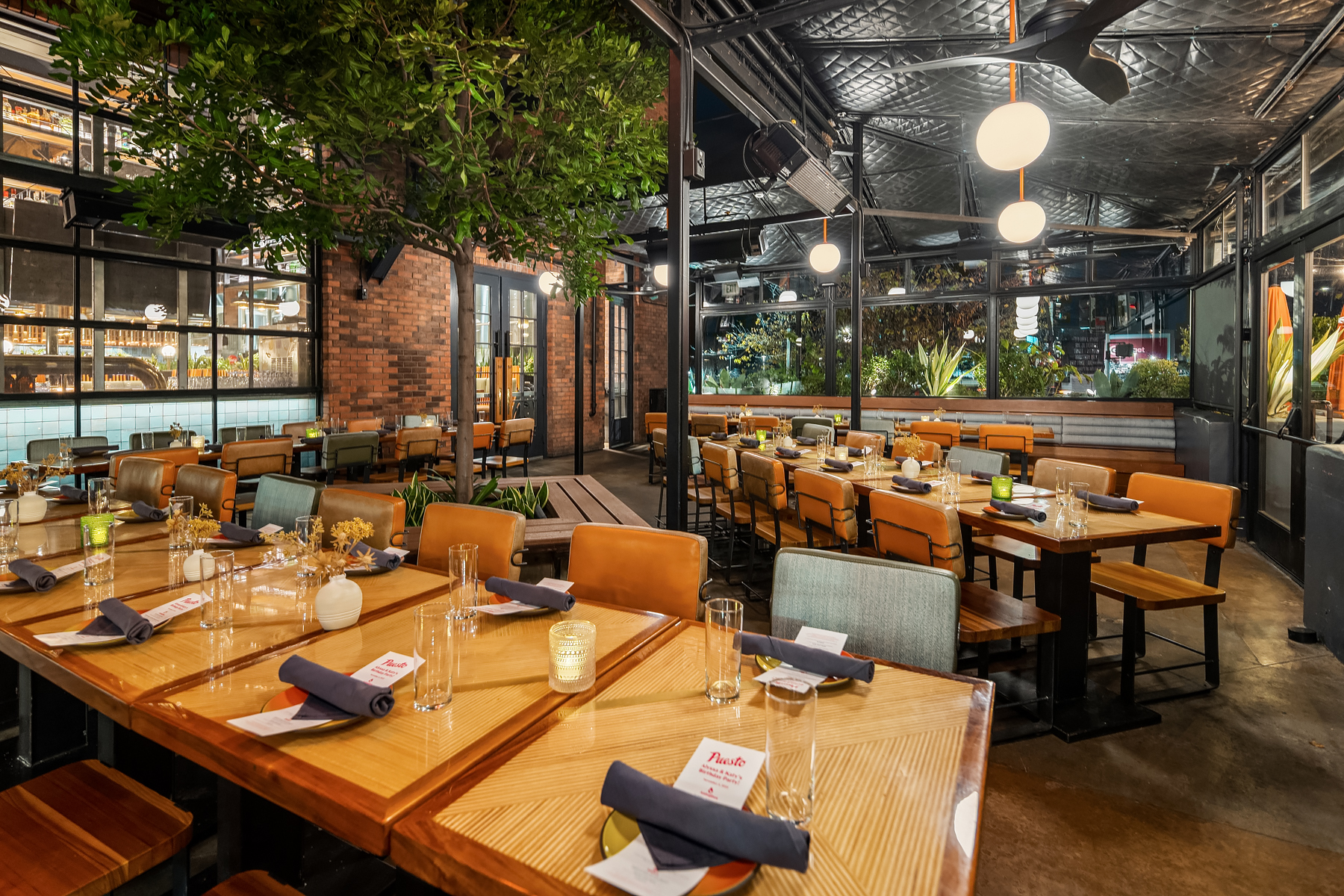a room filled with furniture and a table in front of a building