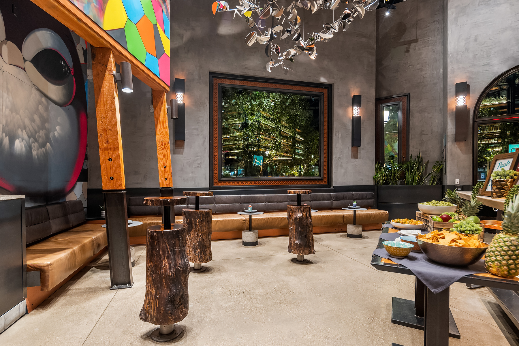 a person sitting at a table in front of a building