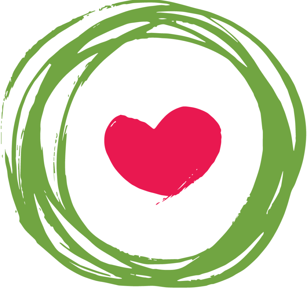 a small pink heart on a green circle