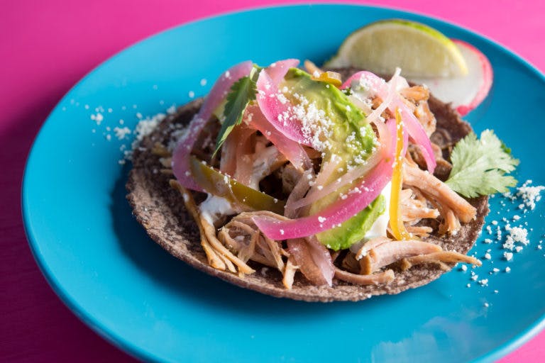 a blue tortilla taco on a plate