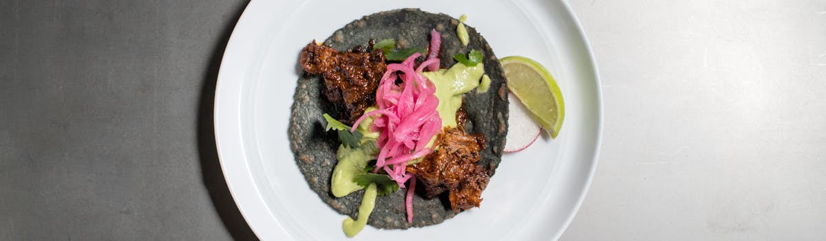 a blue tortilla taco on a plate