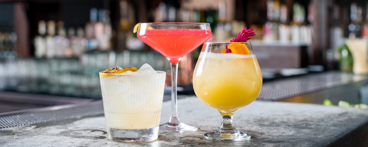 a close up of three drinks