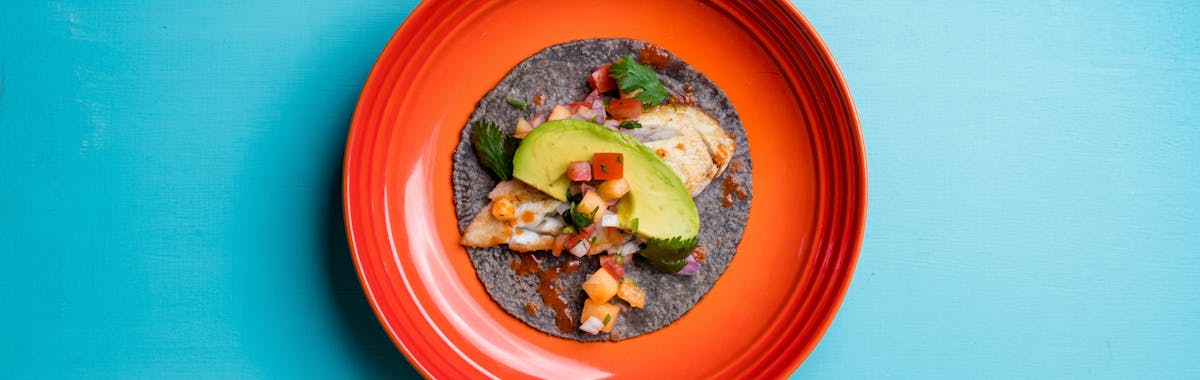 a blue tortilla taco on a plate