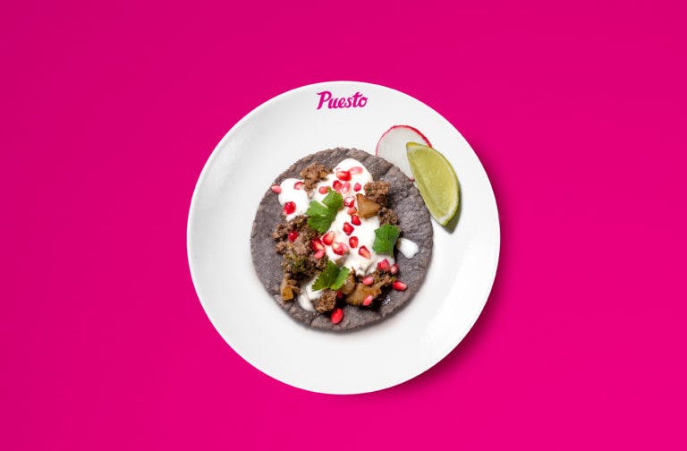 a blue tortilla taco on a plate