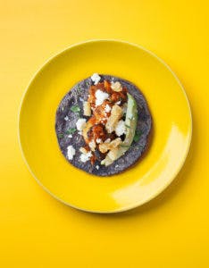 a blue tortilla taco on a plate