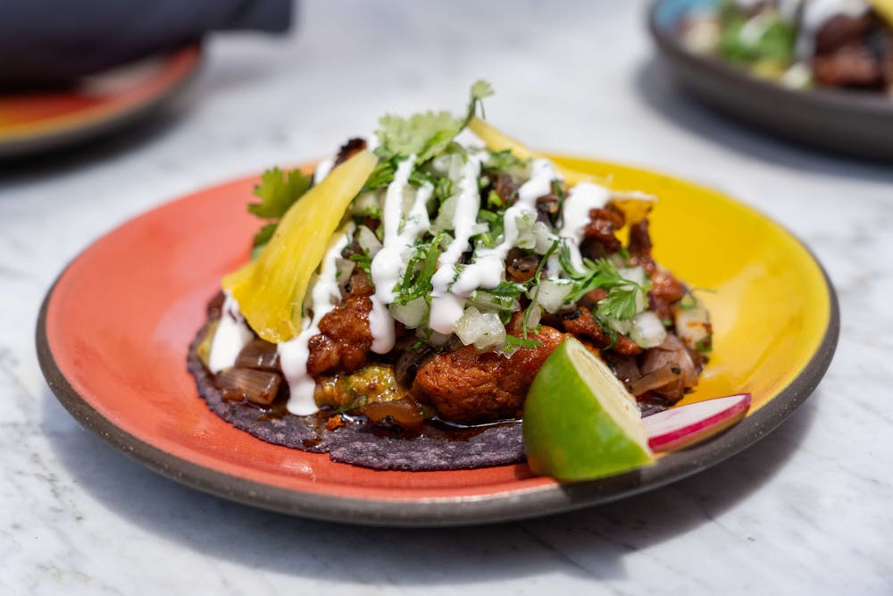 Puesto's new taco, Joe’s Adobada, on a plate.