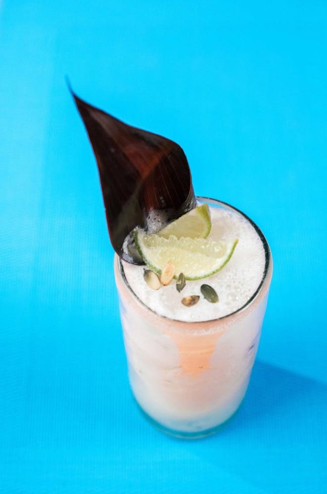 a drink sitting on a blue table