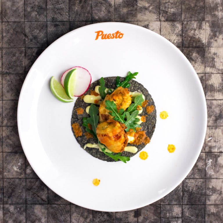 a blue tortilla taco on a plate