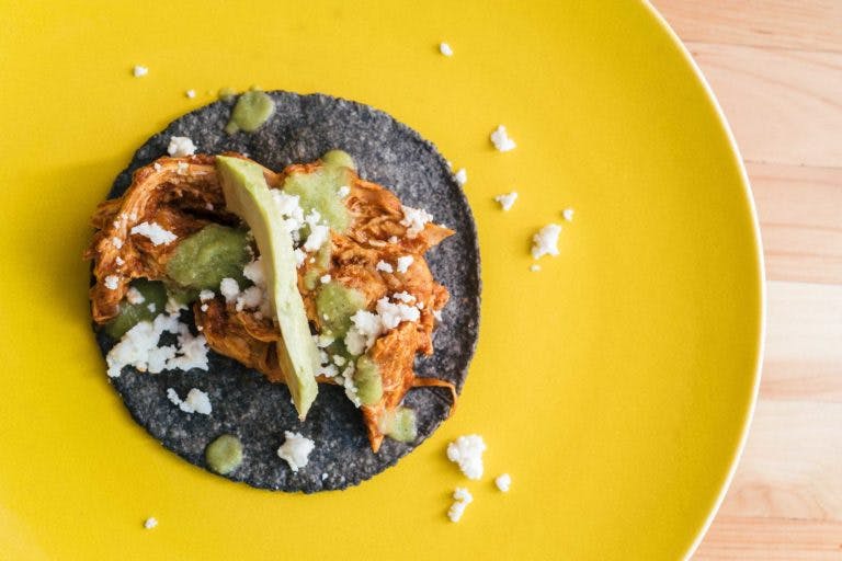 a blue tortilla taco on a plate