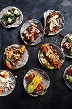 a close up of many different types of food on a table