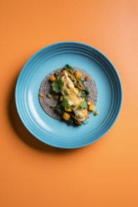 a blue tortilla taco on a plate