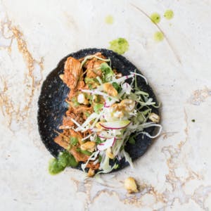 a blue tortilla taco on a table