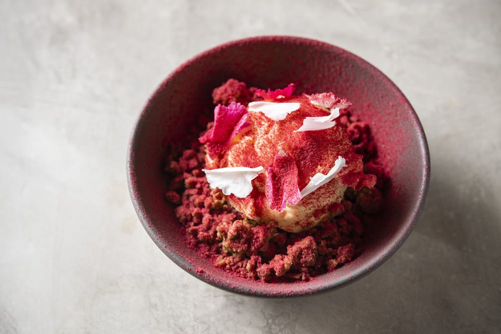 a piece of cake sitting on top of a red plate