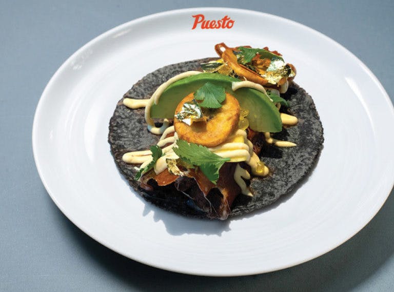a blue tortilla taco on a plate