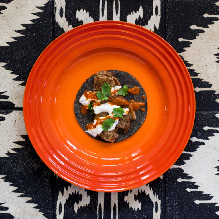 a blue tortilla taco on a plate