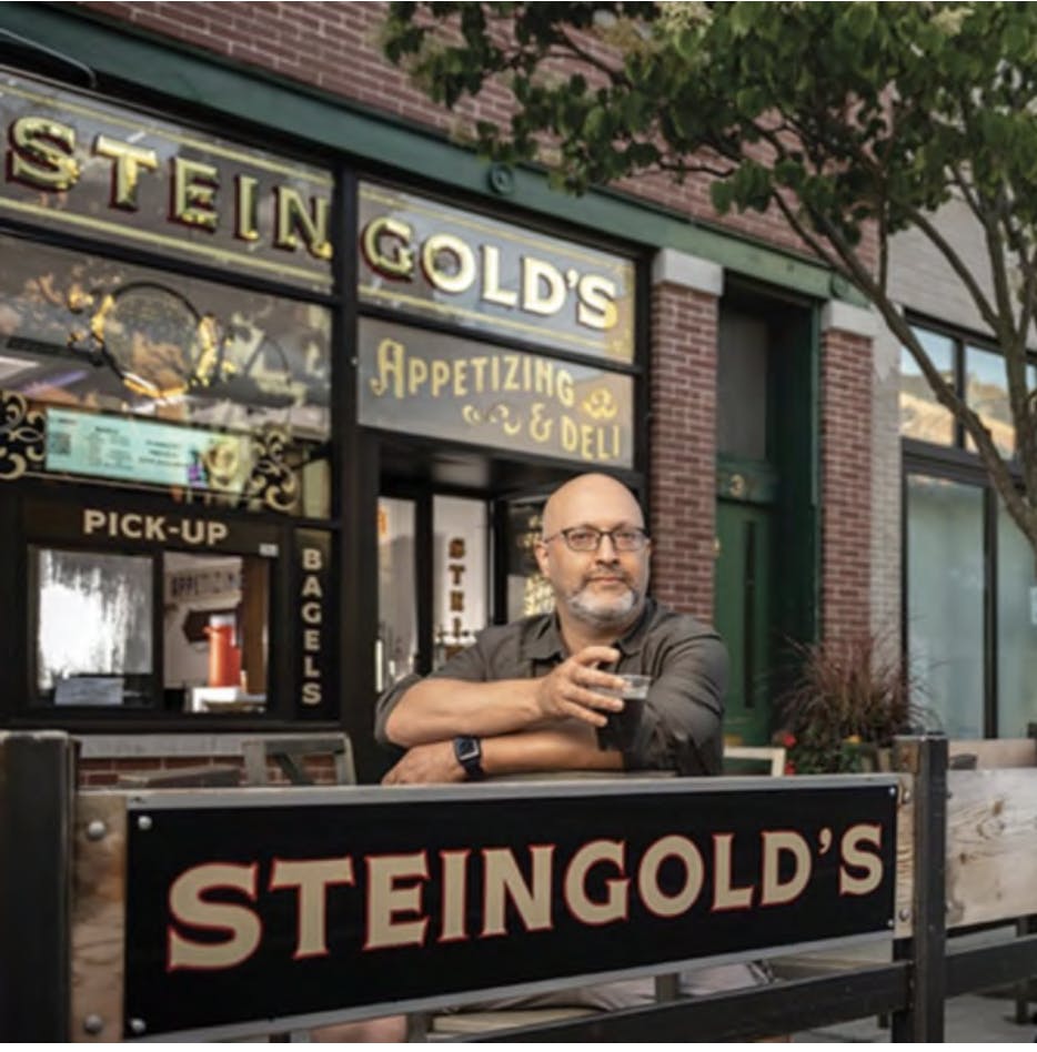 a man standing in front of a store