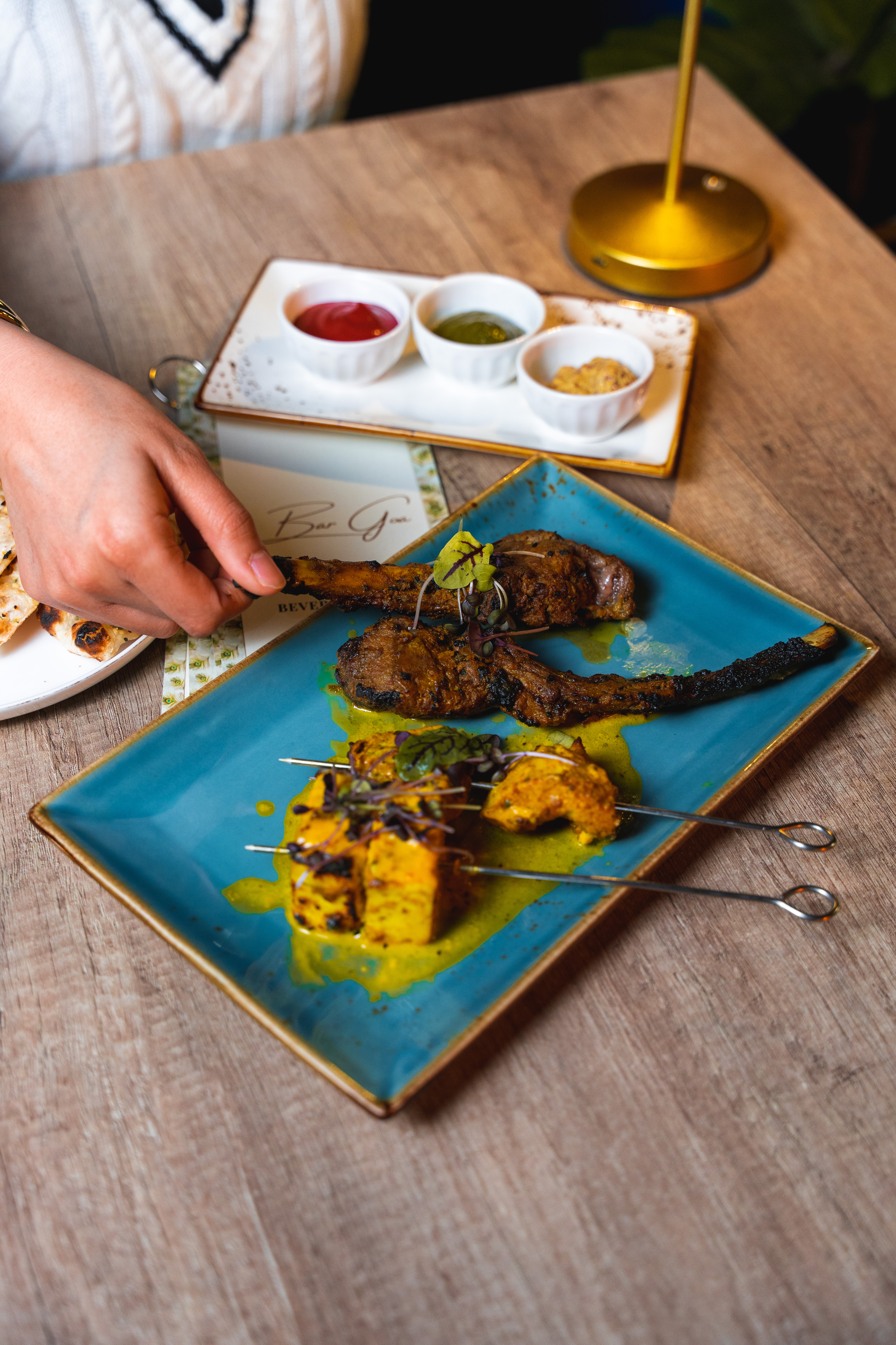 a wooden cutting board with a cake on a table