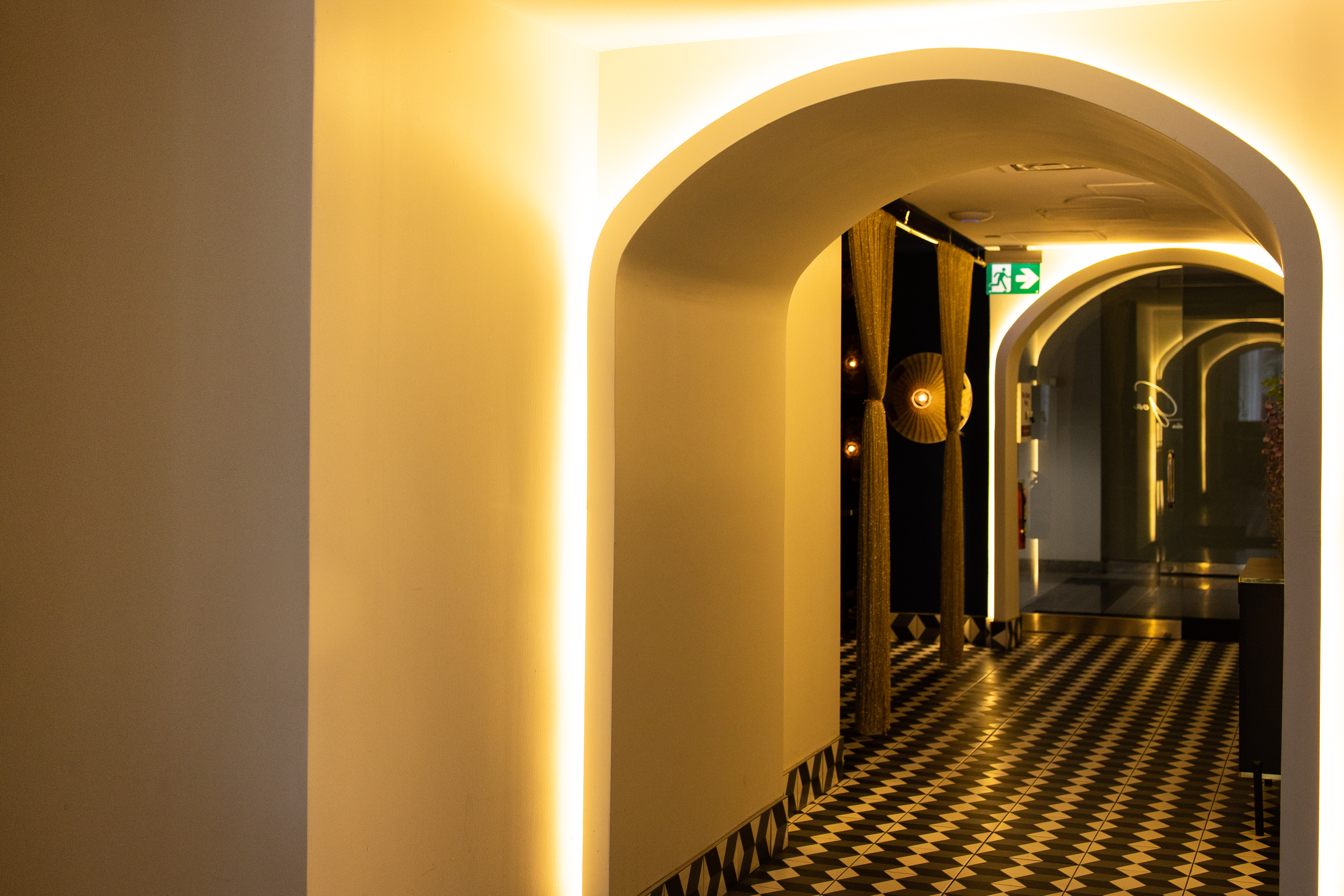 a group of people sitting at a table in front of a laptop