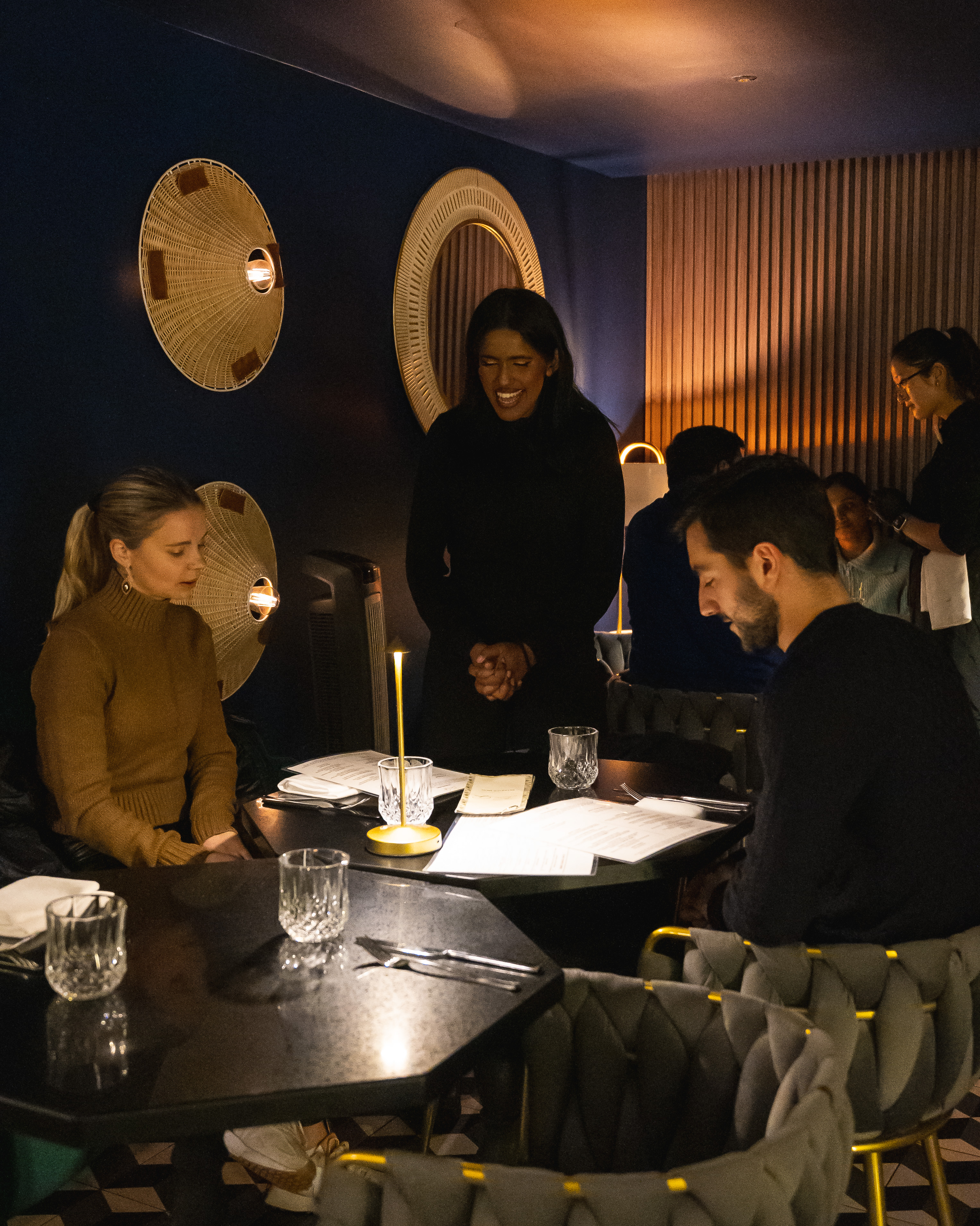 a group of people sitting at a table