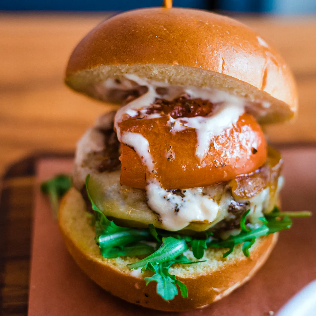 a close up of a sandwich sitting on top of a wooden table