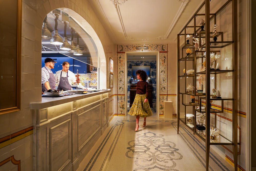 a person standing in front of a mirror posing for the camera