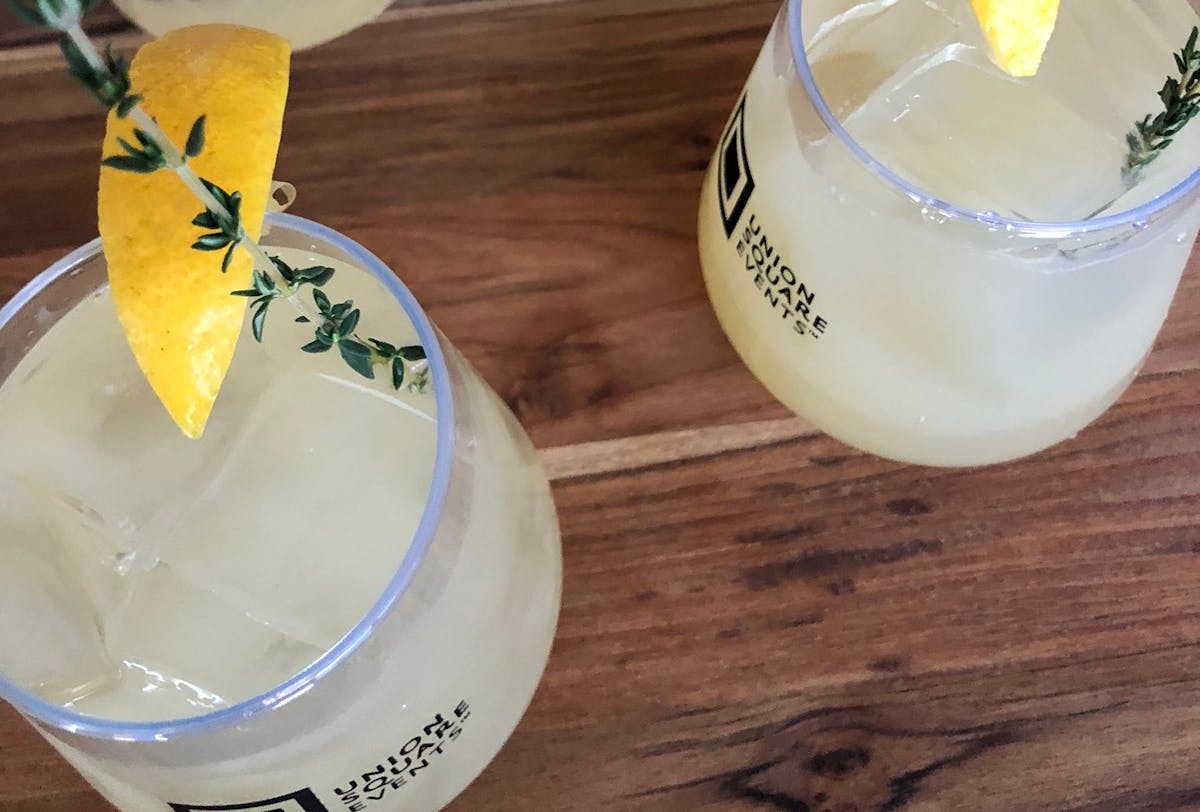 a cup of coffee sitting on top of a wooden table