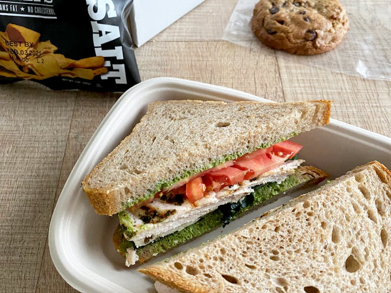 Grilled chicken sandwich box sitting on a table