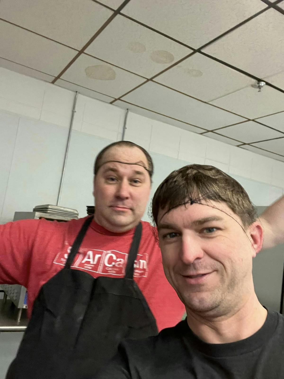 two people posing for the camera