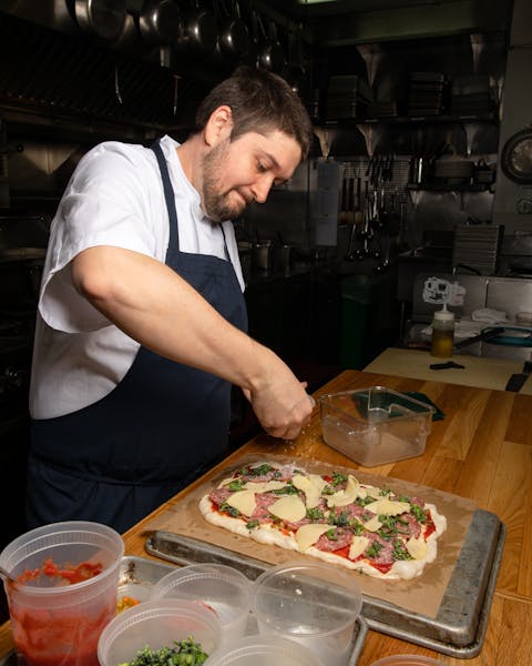a man preparing food on a table