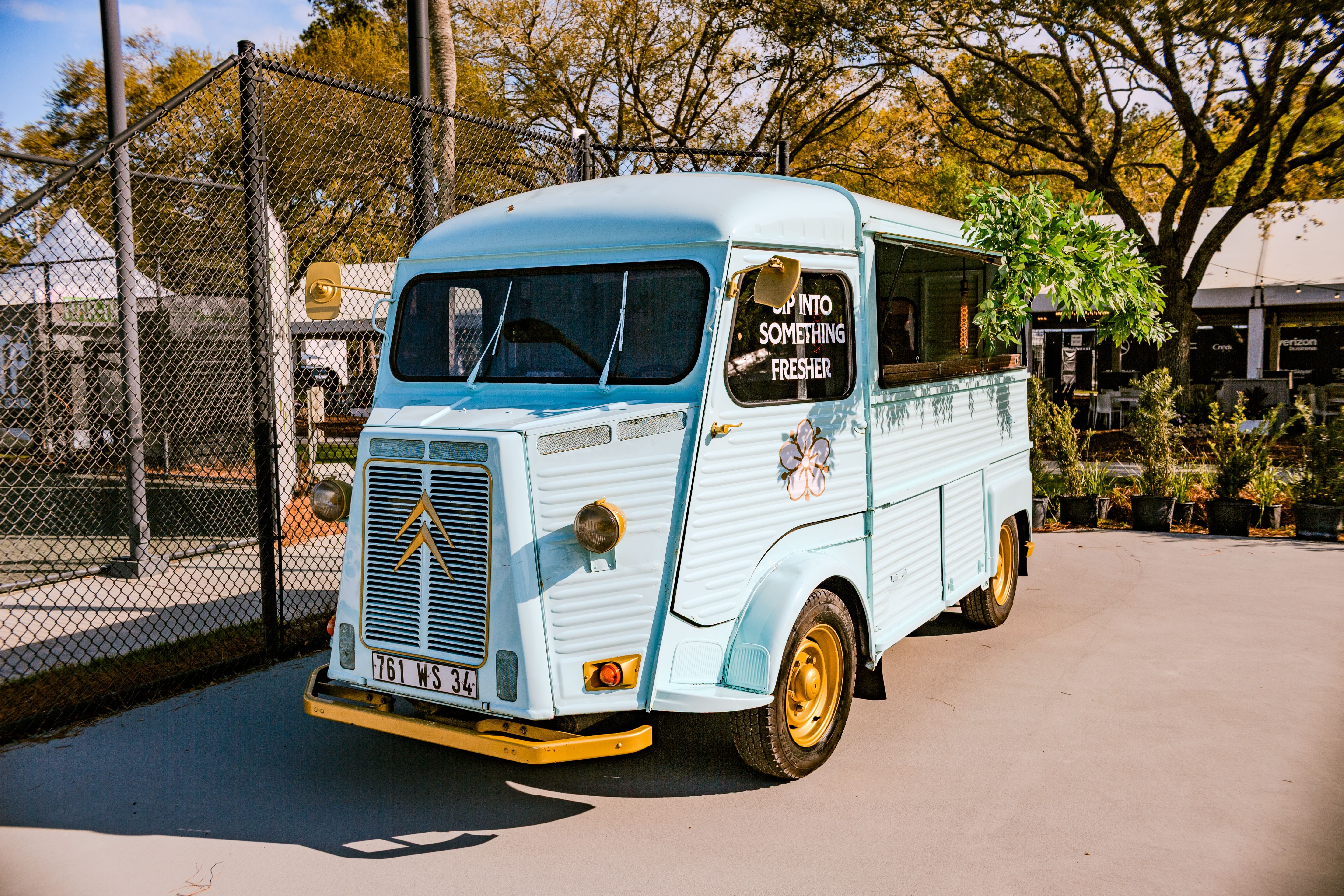 a blue van parked on a road
