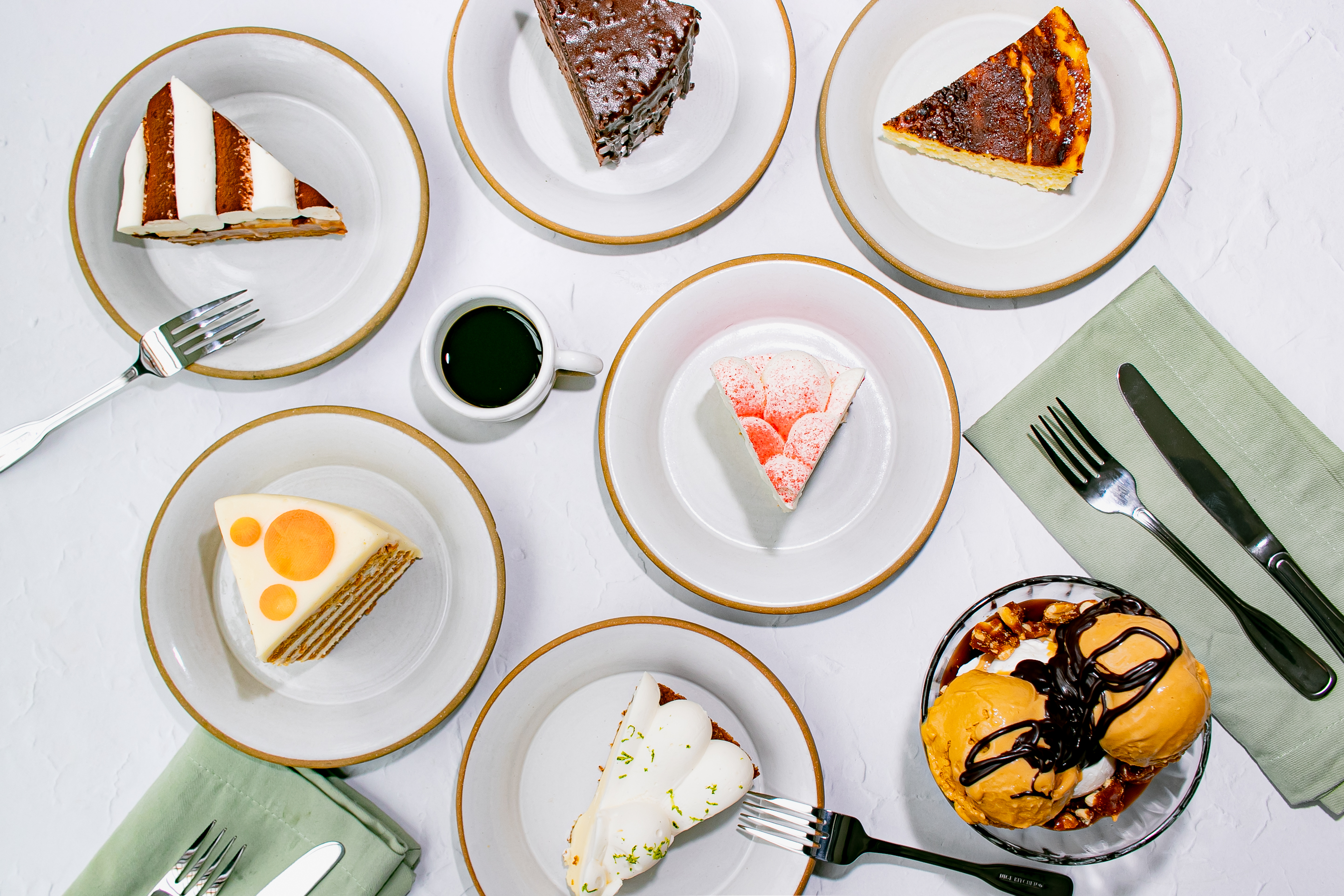a group of plates of desserts