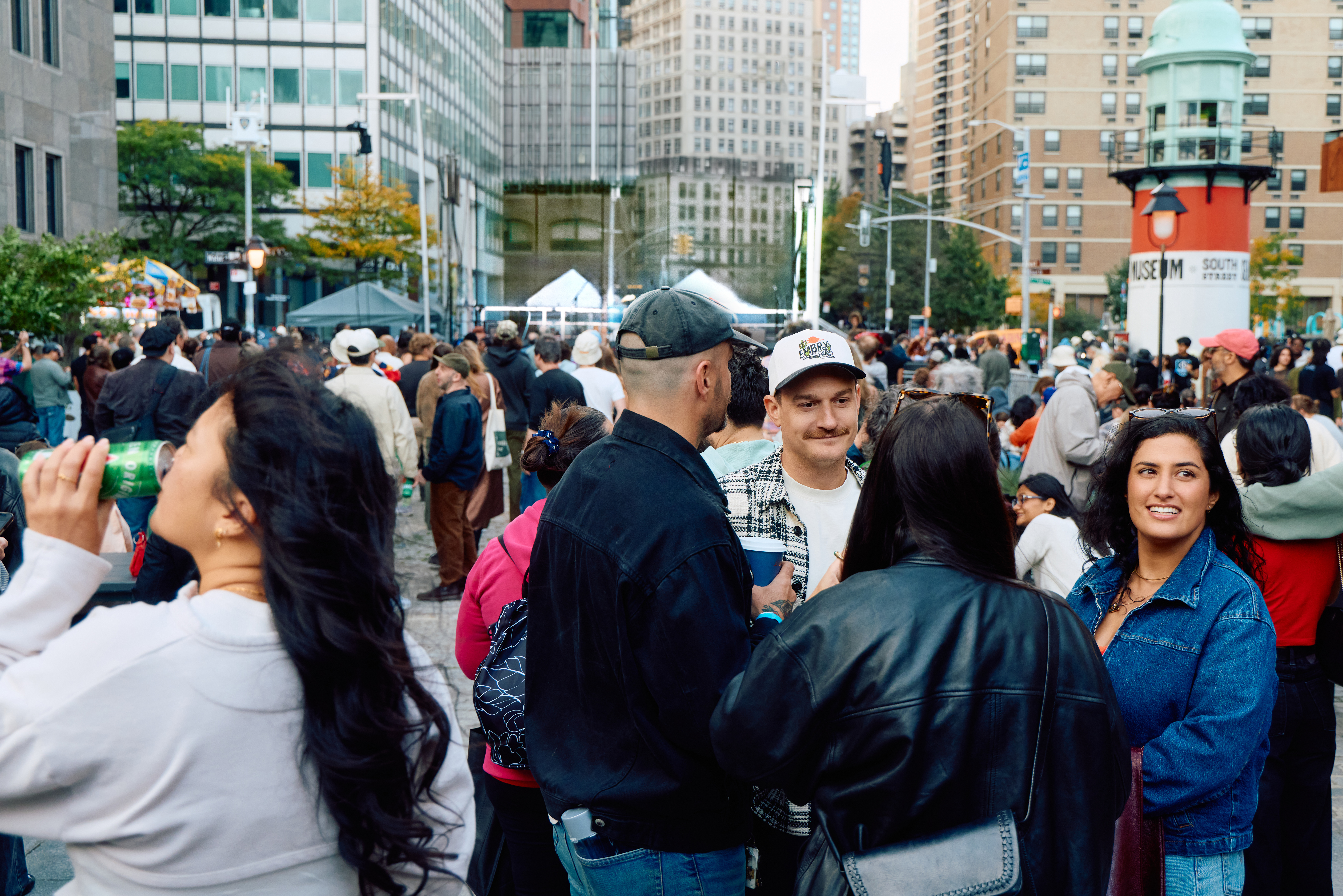 a crowd of people enjoy music on the cobblestones at sadie's garden bar